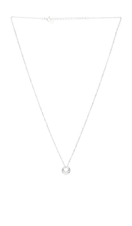 shashi orbit pendant necklace in metallic silver.