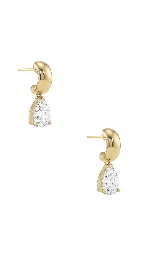 shashi voluta earrings in metallic gold.