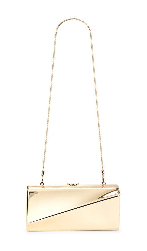 simkhai twist clutch in metallic gold.
