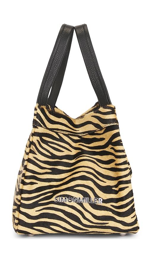 simonmiller calf hair quad bag in brown.