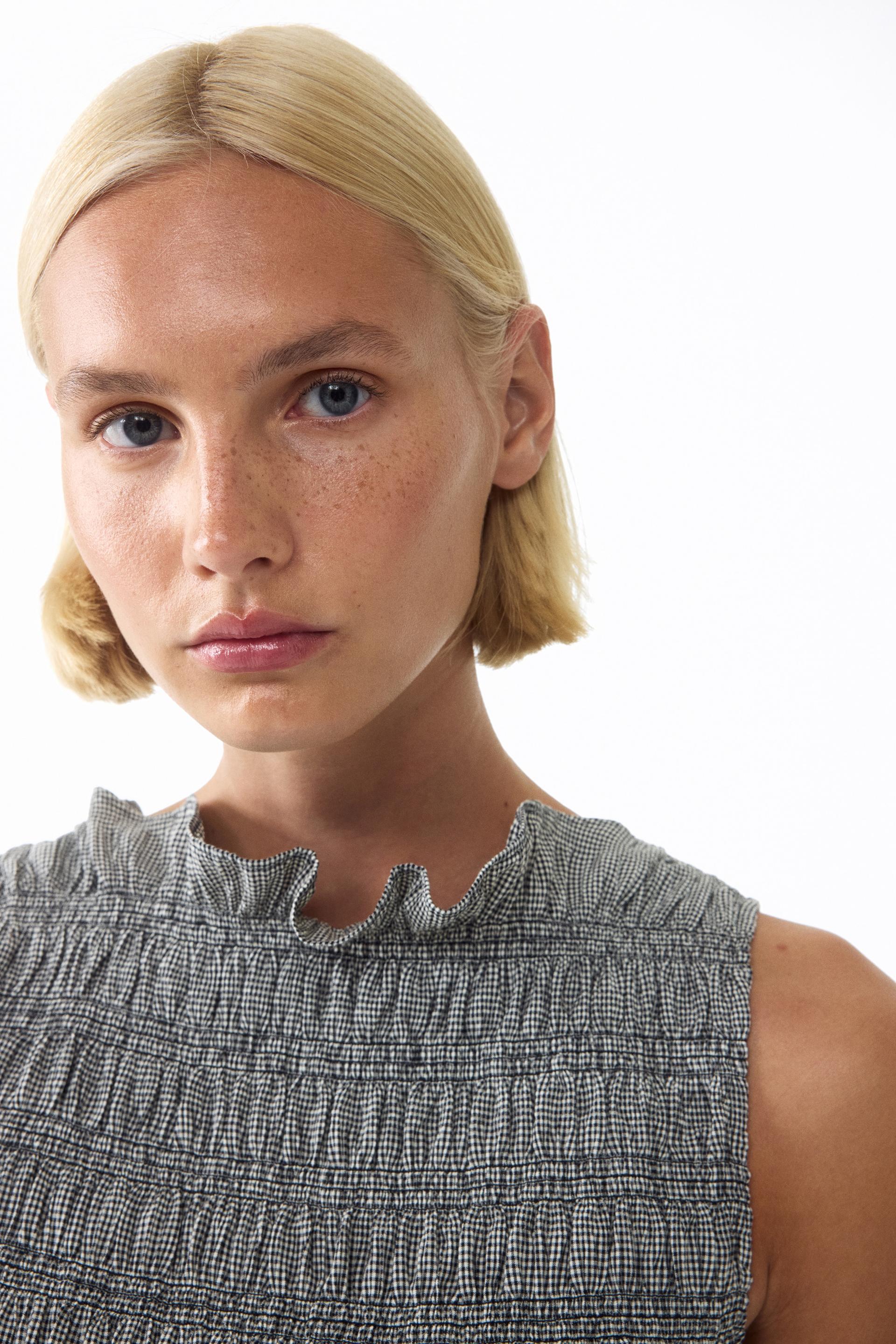 smocked ruffle-trimmed top