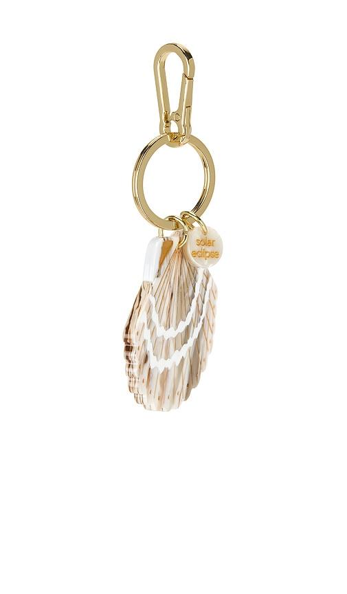 solar eclipse hand-painted bag charm in beige.