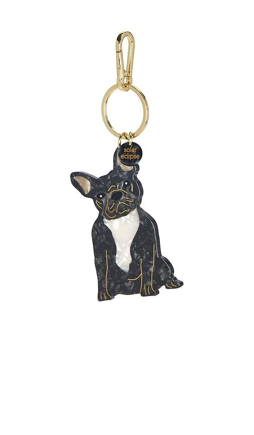 solar eclipse hand-painted bag charm in black.