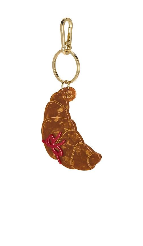 solar eclipse hand-painted bag charm in brown.