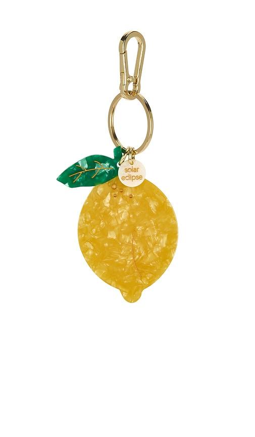 solar eclipse hand-painted bag charm in yellow.