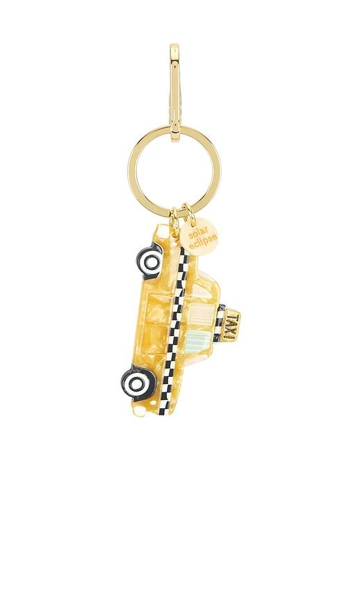 solar eclipse hand-painted bag charm in yellow.
