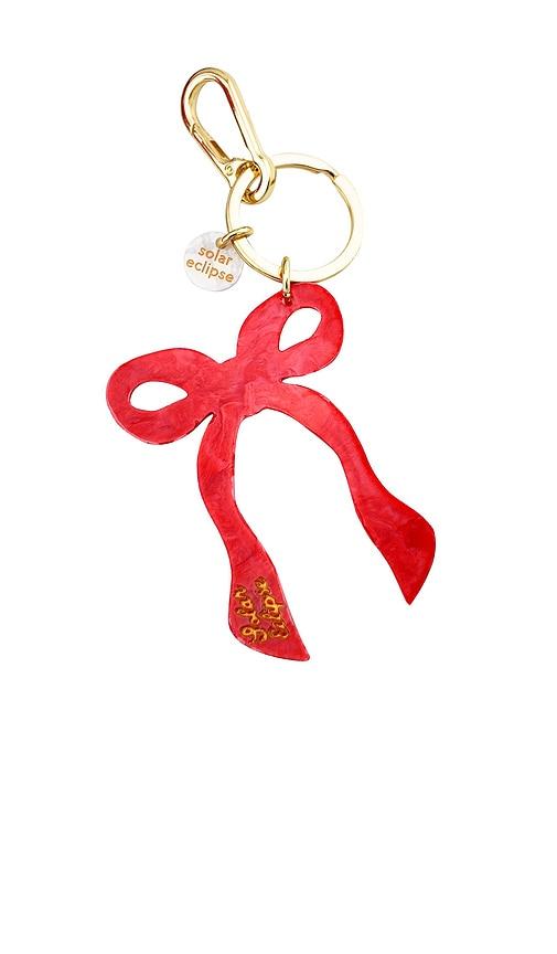 solar eclipse hand-painted coquette bow bag charm + keychain in red.