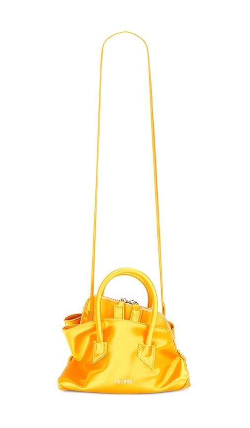 the attico la passeggiata mini top handle bag in orange.