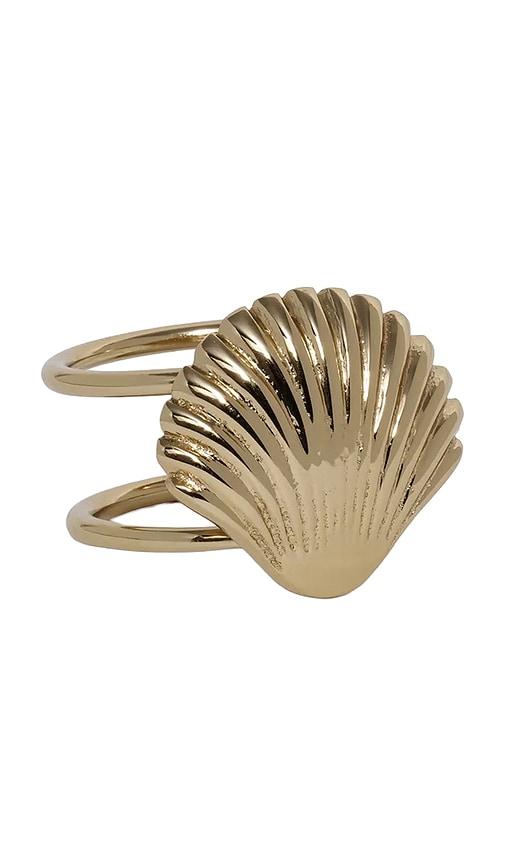 the favorites cap ferrat shell napkin ring set of 4 in metallic gold.