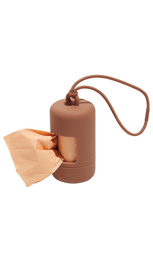 wild one poop bag carrier in brown.